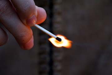match in hand with fire