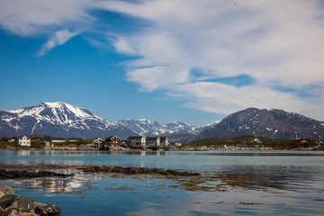 Obraz premium Village and Sea view on mountains in the background in Sommaroya, Norway