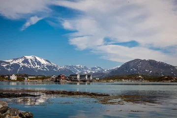 Fotobehang Village and Sea view on mountains in the background in Sommaroya, Norway © Kamila Sankiewicz
