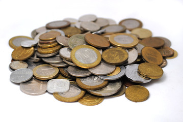 Old and new coins of different countries closeup on white background