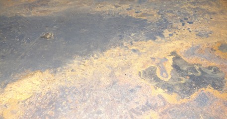 The texture of the metal and rust.