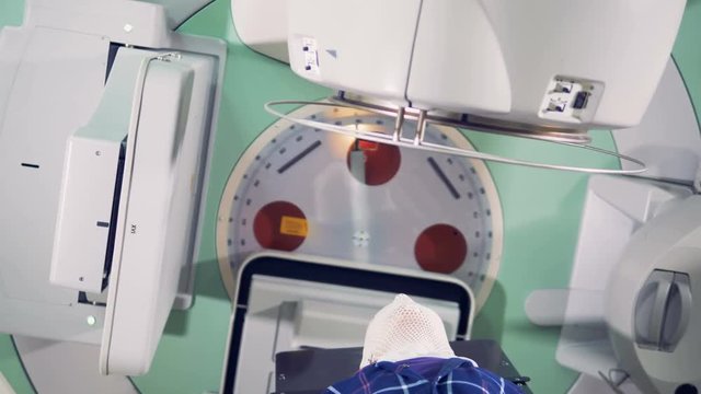 Close up of the elements of the linear accelerator rotating around the patient