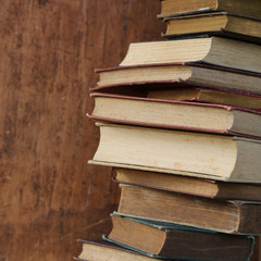 old books on wooden shelf.