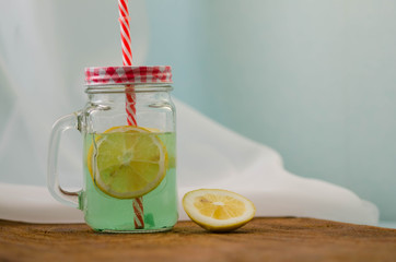 Juice Glass of freshly Fruit juice with lemon on wooden Background. Healthy Food and drink Concept