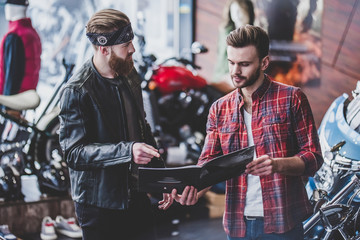 Men in motorcycle shop