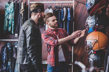 Men in motorcycle shop