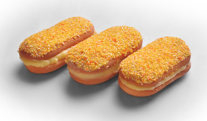 appetizing fresh cakes lie on white paper