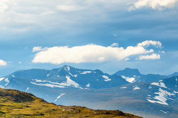 View of a mountain landscape with cloud formations