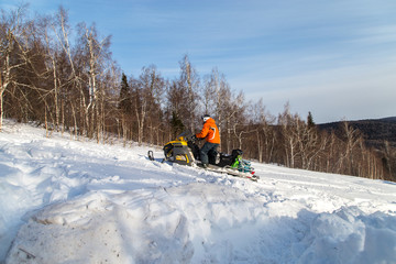 Athlete on a snowmobile