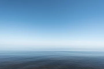 Fotobehang Blauwe en nog steeds Baltische zee. © Janis Smits