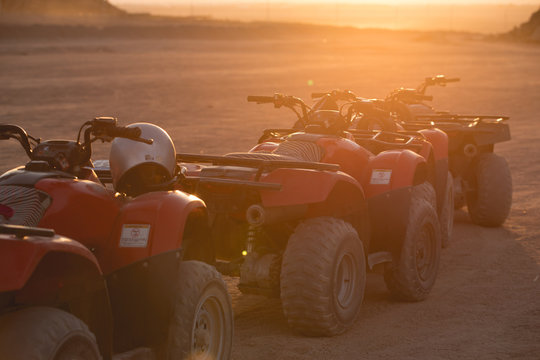 A lot of ATV in sunrise beam in Egypt desert