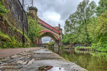 View from the footpath along Rochdale canal in the Castlefield area in the center of Manchester,...