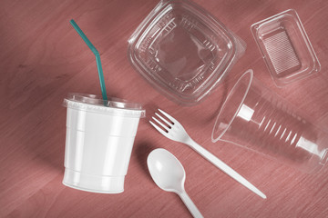 A group of plastic disposable tableware on the table