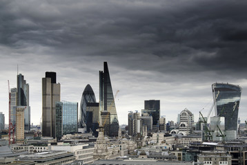 London cityscape skyline with iconic landmark buildings in The City with moody stormy sky