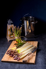 white and green asparagus on kitchen board