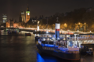 Fototapeta premium Beautiful landscape image of the London skyline at night looking along the River Thames