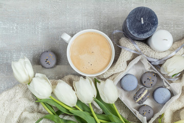 Beautiful romantic composition with coffee, sweet food and flowers