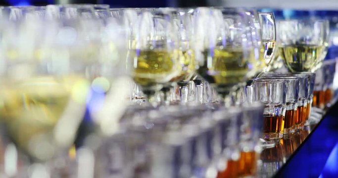 closeup view of glasses with different alcohol beverage on the bar table / night club bartender glass selective focus delicious luxury drink business corporate party buffet cognac restaurant champagne