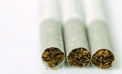 Three vintage cigarette on a white background