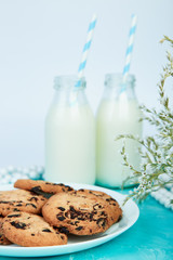 Cookie chocolate with a milk bottles.