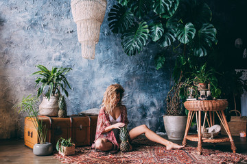 Young girl with pineapple. © dimadasha