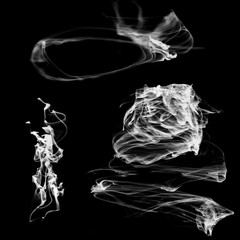 Shapeless smoke jets for design on a black background.