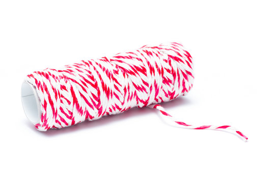 Red and white rope roll for bind the parcel or other on white background