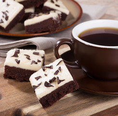 Chocolate fudge brownies and a cup of coffee