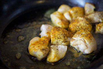 Fry meat in the pan. To cook the sliced meat with seasoning. Cooking meat with spices. 