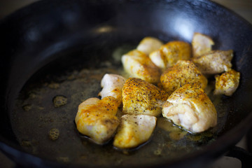Fry meat in the pan. To cook the sliced meat with seasoning. Cooking meat with spices. 