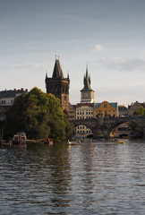 Fototapeta premium Prague's historical center, photo from the river. Embankment and the building of the European city