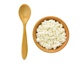 Cottage cheese in a wooden bowl isolated on a white. Clipping path