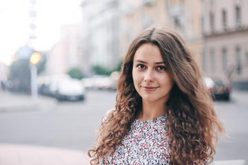  portrait of a long-haired girl in the city.