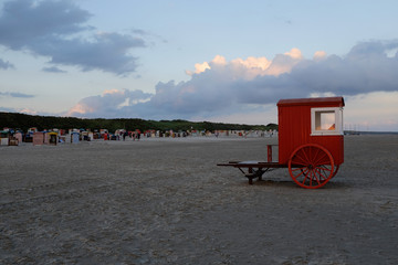 beautiful beach panorama with old, red bathing-cabin car