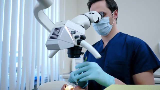 Man dentist and his pacient in private practice.