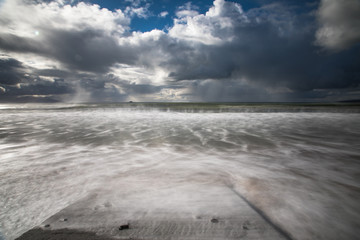Stormy skies and seascape motion blur waves,on the west coast of Ireland, Atlantic ocean.