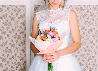 woman bride holding beautiful bouquet flowers