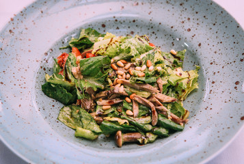 spring salad vegetarian with greens mushrooms
