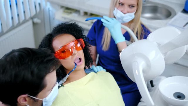 Dentist and his assitant working in private practice.