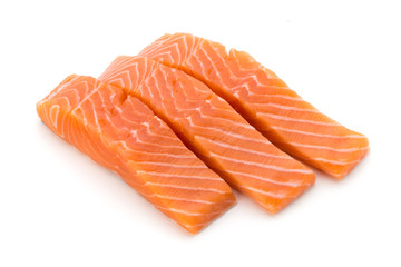 Fresh salmon fillet with basil on the white background.