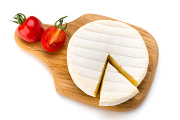Piece of camembert cheese isolated on white background. From top view.