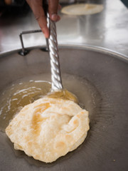 Roti Fried in Oil on The Stove