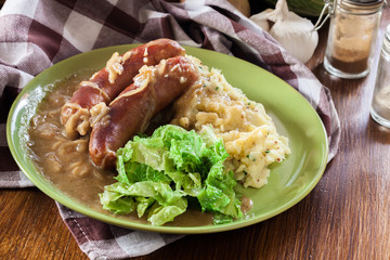 Bangers and Mash. Baked sausage in onion gravy