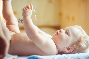 a small child lies on the sheet