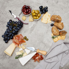 Typical italian antipasto - prosciutto, ham, cheese and olives