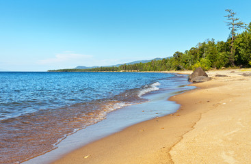 Lake Baikal in the summer. Beautiful sandy beaches on the east coast in the sunny afternoon