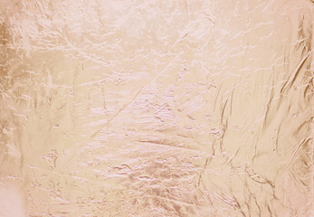 Fototapeta premium Silver foil background with shiny crumpled surface for texture background.