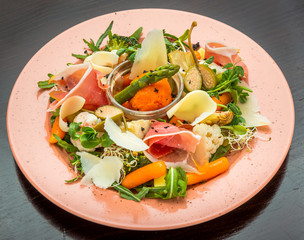 Fresh salad from vegetables, cheese and ham