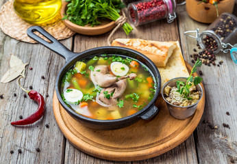 Soup with quail meat, with quail eggs and vegetables