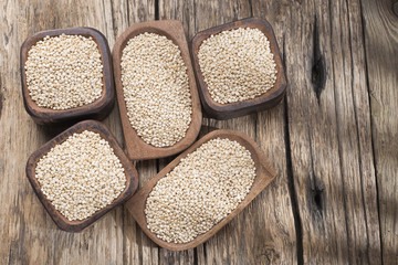 quinoa beans in bowl on rustic wooden background
